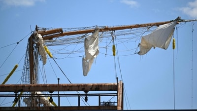 US safety officials launched a probe Sunday after a 150-foot tall Mexican sailing ship crashed into New York's iconic Brooklyn Bridge, snapping its masts and killing two crew members. (AFP) US safety officials launched a probe Sunday after a 150-foot tall Mexican sailing ship crashed into New York's iconic Brooklyn Bridge, snapping its masts and killing two crew members. (AFP)