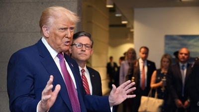 With Speaker of the House Mike Johnson (R-LA) by his side President Donald Trump speaks to the press following a House Republican meeting at the U.S. Capitol on May 20, 2025 in Washington, DC. (AFP) With Speaker of the House Mike Johnson (R-LA) by his side President Donald Trump speaks to the press following a House Republican meeting at the U.S. Capitol on May 20, 2025 in Washington, DC. (AFP)
