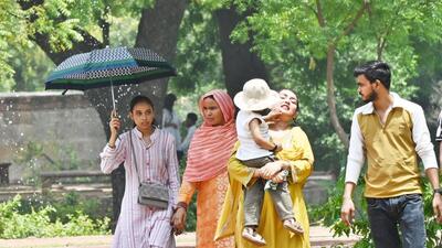 Visitors at Humayun’s Tomb shield themselves from the sun. (Arvind Yadav/HT) Visitors at Humayun’s Tomb shield themselves from the sun. (Arvind Yadav/HT)