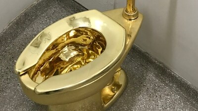 The 18-carat toilet in question was created by the artist Maurizio Cattelan (MossAlbatross via Wikimedia Commons) The 18-carat toilet in question was created by the artist Maurizio Cattelan (MossAlbatross via Wikimedia Commons)