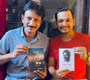 Rajesh Tailang and Paritosh Tripathi pose with each other’s books (Photo: Instagram)