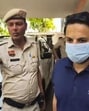 Ashoka University professor Ali Khan Mahmudabad being escorted by Haryana Police personnel after his arrest in Sonepat on Sunday. The Supreme Court on Wednesday granted interim bail to Mahmudabad, but refused to stay the investigation against him. (PTI file photo)
