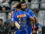 Mumbai Indians' captain Hardik Pandya (R) congratulates his teammate Suryakumar Yadav for his innings Mumbai Indians' captain Hardik Pandya (R) congratulates his teammate Suryakumar Yadav for his innings