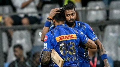 Mumbai Indians' captain Hardik Pandya (R) congratulates his teammate Suryakumar Yadav for his innings (AFP) Mumbai Indians' captain Hardik Pandya (R) congratulates his teammate Suryakumar Yadav for his innings (AFP)