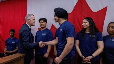 Canada's Prime Minister Mark Carney meets students after making an announcement during his Liberal Party election campaign tour, in Brampton, Ontario, Canada, on April 10. (REUTERS) Canada's Prime Minister Mark Carney meets students after making an announcement during his Liberal Party election campaign tour, in Brampton, Ontario, Canada, on April 10. (REUTERS)