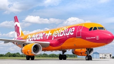 Dunkin' coffee-themed plane by JetBlue (X) Dunkin' coffee-themed plane by JetBlue (X)