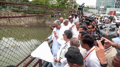 Karnataka Chief Minister Siddaramaiah, State Deputy Chief Minister DK Shivakumar inspect the overflowing drain area of the HBR Layout, in Bengaluru on Wednesday. (ANI) Karnataka Chief Minister Siddaramaiah, State Deputy Chief Minister DK Shivakumar inspect the overflowing drain area of the HBR Layout, in Bengaluru on Wednesday. (ANI)