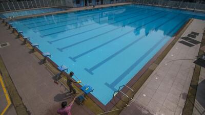 Mumbai, India - November 05, 2020: Workers are seen cleaning up the swimming pool to make it ready to reopen after government has given permission to reopen the swimming pool after being shut for nearly 6-7 months due to Covid-19 pandemic at A.K. Vaidya Swimming Pool, Chembur in Mumbai, India, on Thursday, November 5, 2020. (Photo by Pratik Chorge/Hindustan Times) (Pratik Chorge/HT PHOTO) Mumbai, India - November 05, 2020: Workers are seen cleaning up the swimming pool to make it ready to reopen after government has given permission to reopen the swimming pool after being shut for nearly 6-7 months due to Covid-19 pandemic at A.K. Vaidya Swimming Pool, Chembur in Mumbai, India, on Thursday, November 5, 2020. (Photo by Pratik Chorge/Hindustan Times) (Pratik Chorge/HT PHOTO)