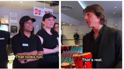 Tom Cruise interacts with a theater staff discussing his iconic airplane jump in Mission Impossible 8 Tom Cruise interacts with a theater staff discussing his iconic airplane jump in Mission Impossible 8