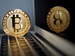 A bitcoin is seen in an illustration picture taken at La Maison du Bitcoin in Paris, France. 