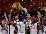 Tottenham Hotspur's Son Heung-min lifts the trophy with teammates after winning the Europa League Final.