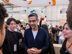 Google CEO Sundar Pichai (C) walks through the AI Sandbox, where attendees can partake in AI driven activities, during Google's annual I/O developers conference in Mountain View, California. Google CEO Sundar Pichai (C) walks through the AI Sandbox, where attendees can partake in AI driven activities, during Google's annual I/O developers conference in Mountain View, California.