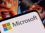 Microsoft has delayed the launch of its Xbox mobile store, blaming Apple's App Store rules and ongoing legal battle. 