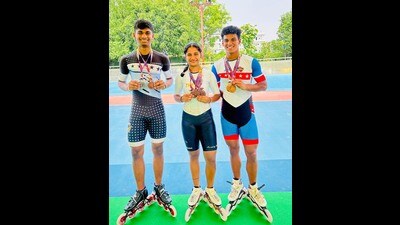 (From left) Kumud Jain, Armaan and Vansh Rawat after winning six medals at the 8th National Speed Skating Ranking Championship in Kerela on Thursday. (HT Photo) (From left) Kumud Jain, Armaan and Vansh Rawat after winning six medals at the 8th National Speed Skating Ranking Championship in Kerela on Thursday. (HT Photo)