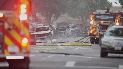 Authorities work the scene where a small plane crashed into a San Diego neighborhood, setting several homes on fire and forcing evacuations along several blocks early Thursday, May 22, 2025. AP/PTI(AP05_22_2025_000354A) (AP) Authorities work the scene where a small plane crashed into a San Diego neighborhood, setting several homes on fire and forcing evacuations along several blocks early Thursday, May 22, 2025. AP/PTI(AP05_22_2025_000354A) (AP)