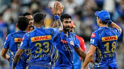 Mumbai Indians' Jasprit Bumrah (C) celebrates with teammates his team's win at the end of the Indian Premier League (IPL) Twenty20 cricket match between Mumbai Indians and Delhi Capitals (AFP) Mumbai Indians' Jasprit Bumrah (C) celebrates with teammates his team's win at the end of the Indian Premier League (IPL) Twenty20 cricket match between Mumbai Indians and Delhi Capitals (AFP)
