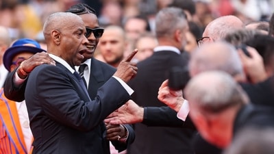 Denzel Washington argues with a photographer next to US singer and actor ASAP Rocky as they arrive for the screening of the film Highest 2 Lowest at the 78th edition of the Cannes Film Festival, on May 19, 2025. (Photo by Sameer AL-DOUMY / AFP) (AFP) Denzel Washington argues with a photographer next to US singer and actor ASAP Rocky as they arrive for the screening of the film Highest 2 Lowest at the 78th edition of the Cannes Film Festival, on May 19, 2025. (Photo by Sameer AL-DOUMY / AFP) (AFP)