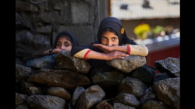 Kashmiri girls look towards houses damaged by artillery shelling from Pakistan upon their return to the border village of Gingal, north of Srinagar (AP) Kashmiri girls look towards houses damaged by artillery shelling from Pakistan upon their return to the border village of Gingal, north of Srinagar (AP)
