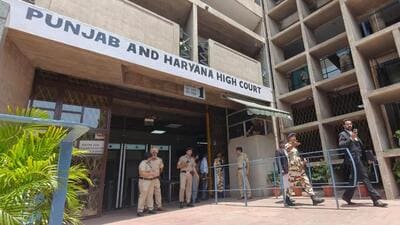Police conducting a search after the bomb threat at the Punjab and Haryana high court complex in Chandigarh on Thursday. (Ravi Kumar/HT) Police conducting a search after the bomb threat at the Punjab and Haryana high court complex in Chandigarh on Thursday. (Ravi Kumar/HT)