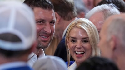 Attorney General Pam Bondi and Tim Tebow arrive before President Donald Trump hosts the 2025 NCAA Champion, University of Florida men's basketball team in the East Room of the White House, Wednesday, May 21, 2025, in Washington. (AP Photo/Julia Demaree Nikhinson) (AP)