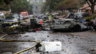 A street is littered with debris where a small plane crashed into San Diego, California, residential street on May 22, 2025. The Federal Aviation Authority said a Cessna 550 crashed at around 3:45 am local time. The neighborhood is close to the Montgomery-Gibbs Executive Airport. The crash left a "gigantic debris field" and damaged some 15 homes and parked cars, ABC News quoted the San Diego assistant fire chief as saying. (Photo by Sandy Huffaker / AFP) (AFP) A street is littered with debris where a small plane crashed into San Diego, California, residential street on May 22, 2025. The Federal Aviation Authority said a Cessna 550 crashed at around 3:45 am local time. The neighborhood is close to the Montgomery-Gibbs Executive Airport. The crash left a "gigantic debris field" and damaged some 15 homes and parked cars, ABC News quoted the San Diego assistant fire chief as saying. (Photo by Sandy Huffaker / AFP) (AFP)