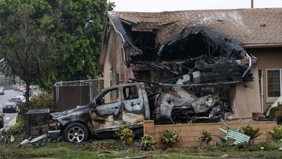 A home is partially destroyed where a small plane crashed into a San Diego, California, residential street on May 22, 2025. The Federal Aviation Authority said a Cessna 550 crashed at around 3:45 am local time. The neighborhood is close to the Montgomery-Gibbs Executive Airport. The crash left a "gigantic debris field" and damaged some 15 homes and parked cars, ABC News quoted the San Diego assistant fire chief as saying. (Photo by Sandy Huffaker / AFP) (AFP) A home is partially destroyed where a small plane crashed into a San Diego, California, residential street on May 22, 2025. The Federal Aviation Authority said a Cessna 550 crashed at around 3:45 am local time. The neighborhood is close to the Montgomery-Gibbs Executive Airport. The crash left a "gigantic debris field" and damaged some 15 homes and parked cars, ABC News quoted the San Diego assistant fire chief as saying. (Photo by Sandy Huffaker / AFP) (AFP)