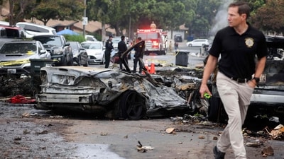 Investigators look through the site where a small plane crashed into San Diego, California, residential street on May 22, 2025. The Federal Aviation Authority said a Cessna 550 crashed at around 3:45 am local time. The neighborhood is close to the Montgomery-Gibbs Executive Airport. The crash left a "gigantic debris field" and damaged some 15 homes and parked cars, ABC News quoted the San Diego assistant fire chief as saying. (Photo by Sandy Huffaker / AFP) (AFP) Investigators look through the site where a small plane crashed into San Diego, California, residential street on May 22, 2025. The Federal Aviation Authority said a Cessna 550 crashed at around 3:45 am local time. The neighborhood is close to the Montgomery-Gibbs Executive Airport. The crash left a "gigantic debris field" and damaged some 15 homes and parked cars, ABC News quoted the San Diego assistant fire chief as saying. (Photo by Sandy Huffaker / AFP) (AFP)