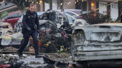 Investigators look through the site where a small plane crashed into San Diego, California, residential street on May 22, 2025. The Federal Aviation Authority said a Cessna 550 crashed at around 3:45 am local time. The neighborhood is close to the Montgomery-Gibbs Executive Airport. The crash left a "gigantic debris field" and damaged some 15 homes and parked cars, ABC News quoted the San Diego assistant fire chief as saying. (Photo by Sandy Huffaker / AFP) (AFP) Investigators look through the site where a small plane crashed into San Diego, California, residential street on May 22, 2025. The Federal Aviation Authority said a Cessna 550 crashed at around 3:45 am local time. The neighborhood is close to the Montgomery-Gibbs Executive Airport. The crash left a "gigantic debris field" and damaged some 15 homes and parked cars, ABC News quoted the San Diego assistant fire chief as saying. (Photo by Sandy Huffaker / AFP) (AFP)