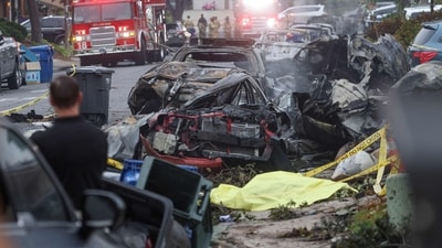 Investigators look through the site where a small plane crashed on a San Diego, California, residential street on May 22, 2025. The Federal Aviation Authority said a Cessna 550 crashed at around 3:45 am local time. The neighborhood is close to the Montgomery-Gibbs Executive Airport. The crash left a "gigantic debris field" and damaged some 15 homes and parked cars, ABC News quoted the San Diego assistant fire chief as saying. (Photo by Sandy Huffaker / AFP) (AFP) Investigators look through the site where a small plane crashed on a San Diego, California, residential street on May 22, 2025. The Federal Aviation Authority said a Cessna 550 crashed at around 3:45 am local time. The neighborhood is close to the Montgomery-Gibbs Executive Airport. The crash left a "gigantic debris field" and damaged some 15 homes and parked cars, ABC News quoted the San Diego assistant fire chief as saying. (Photo by Sandy Huffaker / AFP) (AFP)