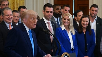 US President Donald Trump welcomes the 2025 NCAA Basketball champions Florida Gators as their head coach Todd Raymond Golden (C) and US Attorney General Pam Bondi(3R) look on to the East Room in the White House in Washington, DC, on May 21, 2025. (Photo by Jim WATSON / AFP) (AFP)