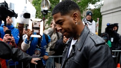 NEW YORK, NEW YORK - MAY 22: Kid Cudi departs the Manhattan Federal Court during the Sean "Diddy" Combs' trial on May 22, 2025 in New York City. Combs, 55, has pleaded not guilty on all counts, which include a racketeering charge alleging the hip-hop pioneer was the leader of a sex crime ring that included drug-fueled sex parties through the use of force, threats and violence   John Lamparski/Getty Images/AFP (Photo by John Lamparski / GETTY IMAGES NORTH AMERICA / Getty Images via AFP) (Getty Images via AFP)