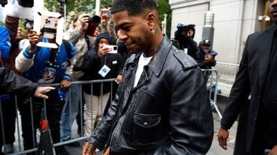 NEW YORK, NEW YORK - MAY 22: Kid Cudi departs the Manhattan Federal Court during the Sean "Diddy" Combs' trial on May 22, 2025 in New York City. Combs, 55, has pleaded not guilty on all counts, which include a racketeering charge alleging the hip-hop pioneer was the leader of a sex crime ring that included drug-fueled sex parties through the use of force, threats and violence   John Lamparski/Getty Images/AFP (Photo by John Lamparski / GETTY IMAGES NORTH AMERICA / Getty Images via AFP) (Getty Images via AFP)