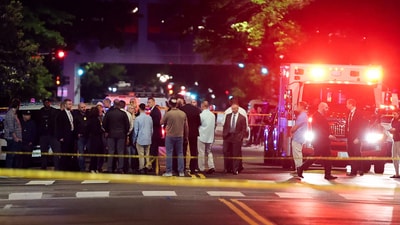 DC shooting: : US Attorney General Pam Bondi and Israeli Ambassador to the US Yechiel Leiter speak to the law enforcement officials as they visit the site where two Israeli embassy staff were shot dead near the Capital Jewish Museum in Washington. (REUTERS)
