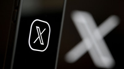 This illustration photograph shows the logo of social network X (formerly Twitter) displayed on a smartphone. (AFP/File)
