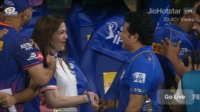 Sachin Tendulkar shaking hands with Nita Ambani Sachin Tendulkar shaking hands with Nita Ambani