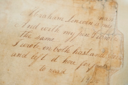 A page that shows the earliest known example of Abraham Lincoln's handwriting is on display at Freeman's. (AP)