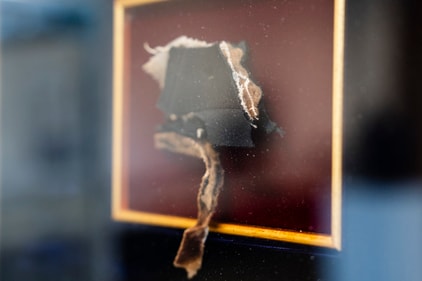 A piece of Abraham Lincoln's coat, which he wore when he was assassinated at Ford's Theatre on April 14, 1865. (AP)