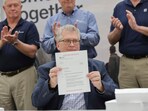 In this photo provided by Tennessee Valley Authority, Scott Hunnewell, vice president of the utility’s New Nuclear Program, signs the construction permit application to build a small modular reactor, Monday, May 19, 2025, in Chattanooga, Tenn. In this photo provided by Tennessee Valley Authority, Scott Hunnewell, vice president of the utility’s New Nuclear Program, signs the construction permit application to build a small modular reactor, Monday, May 19, 2025, in Chattanooga, Tenn.