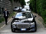Vehicles of Iranian delegation leave the Omani embassy after a fifth round of nuclear talks between Iran and the United States, in Rome on May 23.