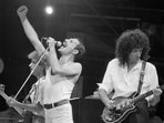 Freddie Mercury, Brian May and John Deacon of the band Queen perform at Live Aid in London, Britain, July 13, 1985.  REUTERS/Rob Taggart     BRIAN MAY FREDDIE MERCURY JOHN DEACON