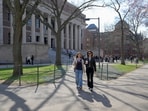 People walk on the campus of Harvard University in Cambridge, Massachusetts, U.S.