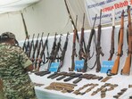 Arms and ammunitions of Naxals, recovered during an operation on Wednesday, being displayed, in Narayanpur, Chhattisgarh.