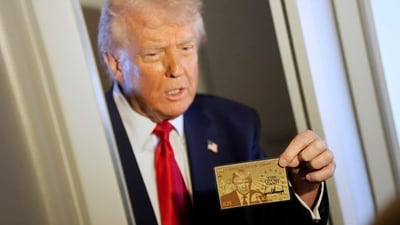 President Donald Trump holds up the $5 million gold card as he speaks to reporters while in flight on board Air Force One, en route to Miami, Thursday, April 3, 2025. AP/PTI(AP04_04_2025_000030B) (AP) President Donald Trump holds up the $5 million gold card as he speaks to reporters while in flight on board Air Force One, en route to Miami, Thursday, April 3, 2025. AP/PTI(AP04_04_2025_000030B) (AP)