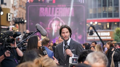 Keanu Reeves speaks to the media upon arrival at the World premiere of the film 'Ballerina' in London, (Alberto Pezzali/Invision/AP)