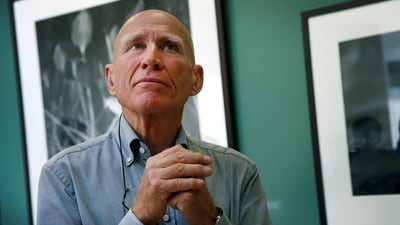 Brazilian photographer Sebastião Salgado leads a tour of his exhibition, "Sebastião Salgado: Genesis," on April 24, 2014, at the National Museum of Singapore. (AP Photo/Wong Maye-E, File) (AP)