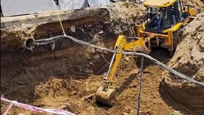 Rescue personnel at the site where soil collapsed on four workers at Old Faridabad Railway Station. (PTI)