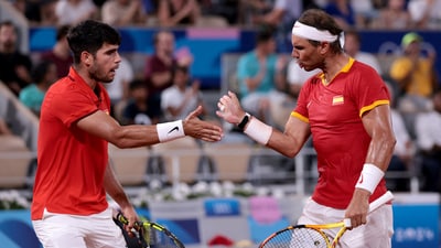 Carlos Alcaraz and Rafael Nadal react during a match at the 2024 Paris Olympics. (REUTERS)