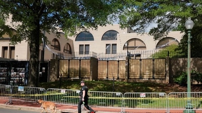 A K-9 officer walks by the Israeli Embassy on May 23, 2025 in Washington, DC. ( AFP)