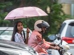 Commuters during heavy rain in Mumbai on May 22, 2025 Commuters during heavy rain in Mumbai on May 22, 2025