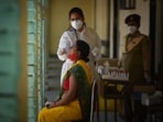 A health worker in PPE Coveralls collects a swab sample to test for Covid infection at a school in Janakpuri, New Delhi on May 26, 2021. A health worker in PPE Coveralls collects a swab sample to test for Covid infection at a school in Janakpuri, New Delhi on May 26, 2021.